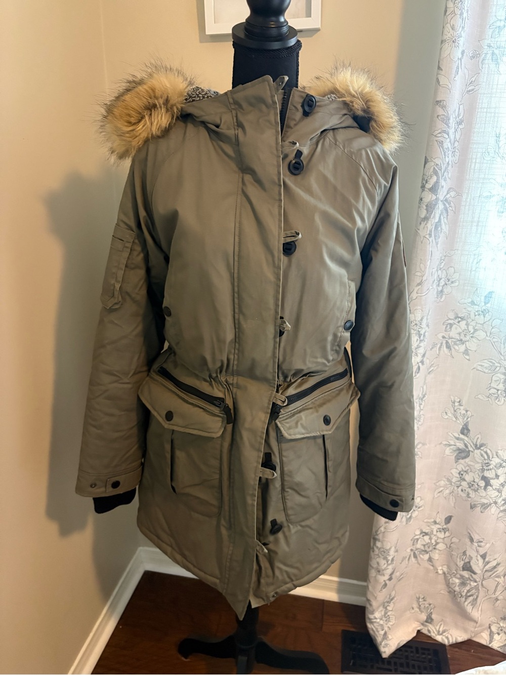 Roots Olive Green Faux-Fur Hooded Puffer Parka with removable fur trim.